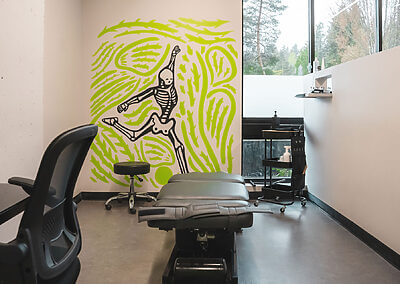 Redmond location patient bay with skeleton mural on wall