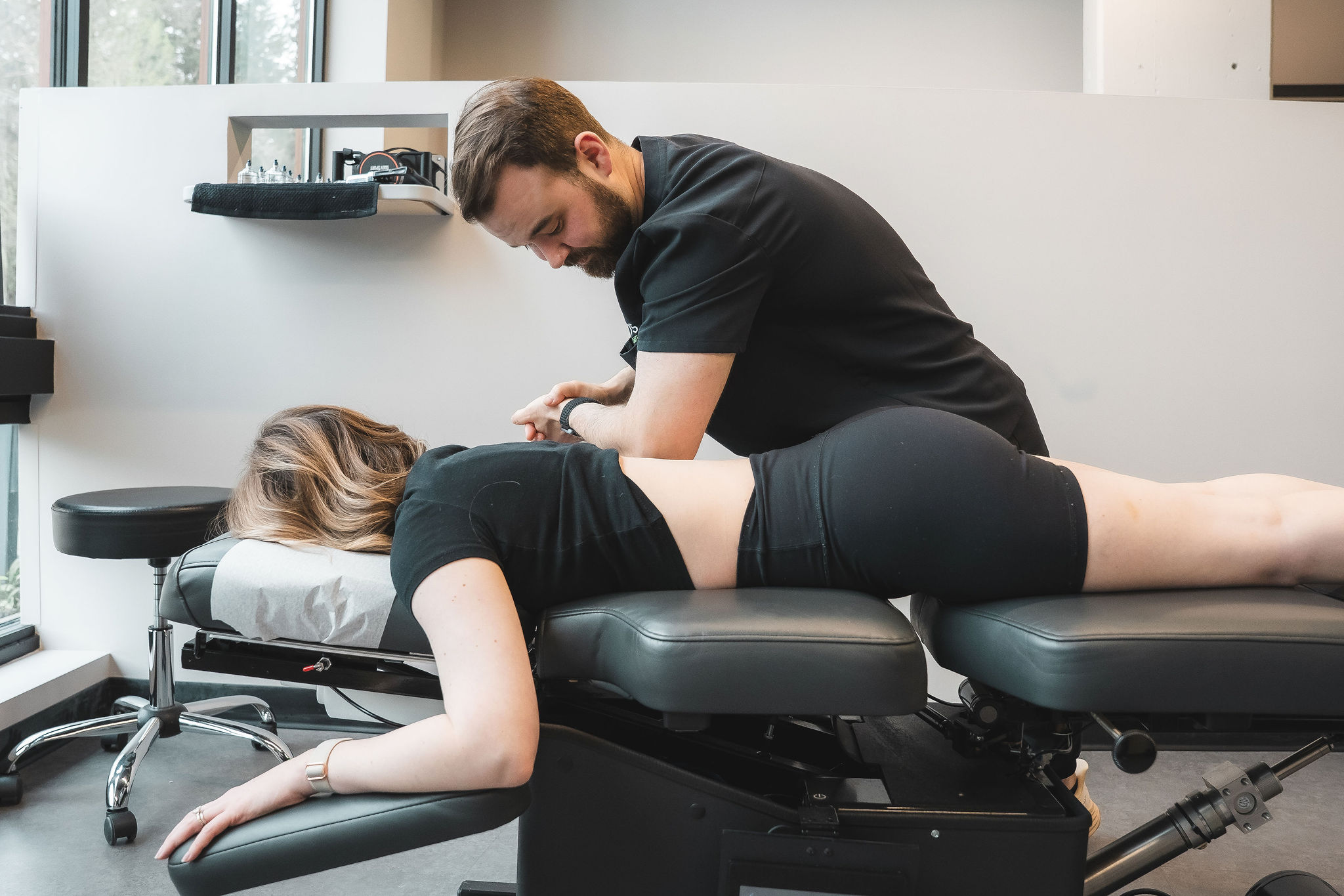 tristan-fm Dr. Tristan performing the FM method on a patient laying facing down on a table